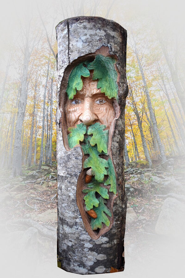 Wood spirit carving green man tree face with oak leaves colored